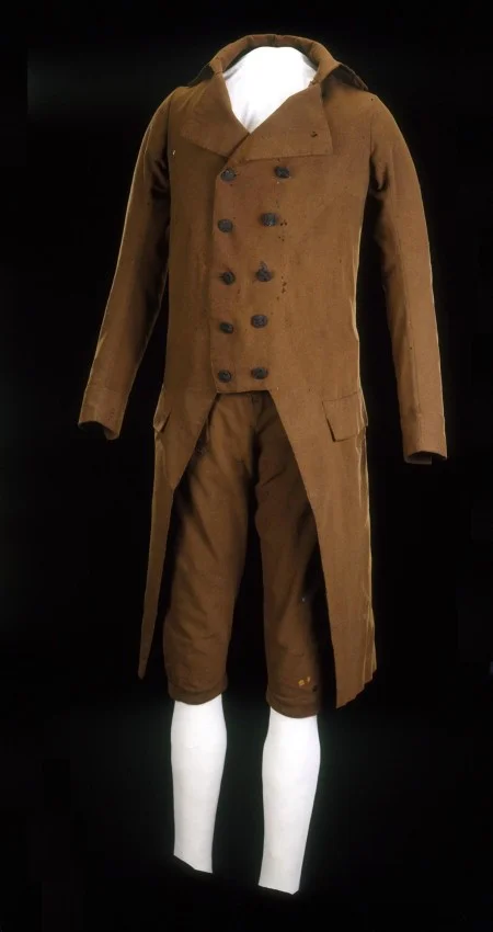 This brown broadcloth suit owned by Washington, with its more informal double-breasted coat, may have been worn by him for dressy daytime events. Although evidence is inconclusive, this might have been the suit worn for his first inauguration. Gift of John Murray Forbes, with appreciation to William D. McGregor, 1877 (MVLA)