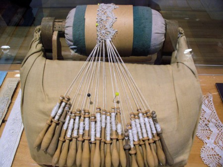 Bobbin lace-making in progress (Wikimedia Commons)
