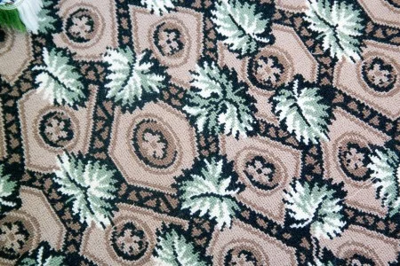 The reproduction Wilton carpets replicate a late-eighteenth century Roman flooring pattern.