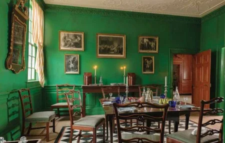 One of the recently purchased tables is displayed in the dining room set for a small number of visitors. Photograph by Walter Smalling, Jr.